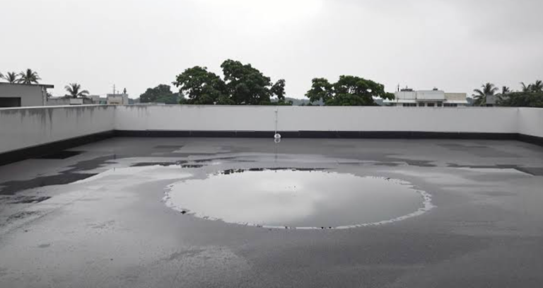 The Real Cost Of Letting Water Sit On A Flat Roof